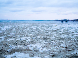 Snow on beach sand