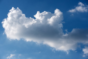 Naklejka na ściany i meble White cloud in the blue sky