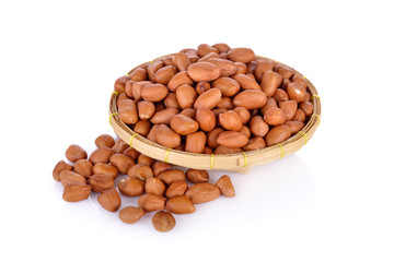 dry peanut in bamboo basket on white background