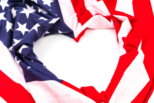 Heart shape American flag on white background .