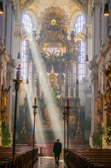 The ray of light shines through windows in St. Peter's Church in Munich, Germany No.4