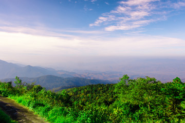 Obraz premium Great view of the foggy Beautiful landscape on mountain with nice sky in sunset .