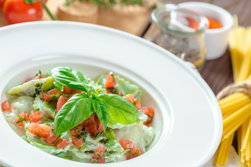 Ravioli pasta from green dough stuffing