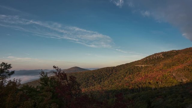 4K TL BRP Sunrise and Clouds as the mountains burst with autumn colors