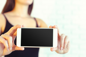 Woman with modern mobile phone in hands