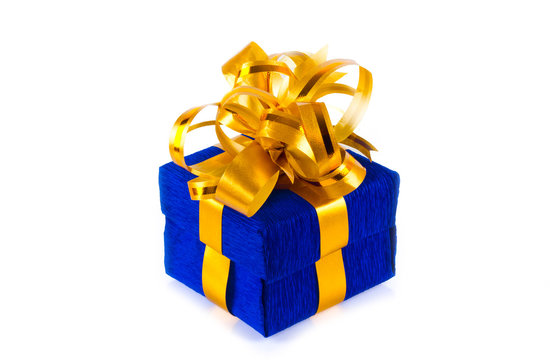 blue gift box with golden bow on a white background for isolation