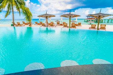Swimming pool bar in tropical Maldives island .