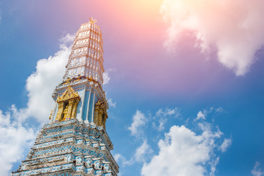Thai temple pagoda of Travel landmark Wat Phra Kaew or Wat Phra Sri Rattana Satsadaram with sky composition space for text.