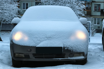 Obraz premium car covered snow