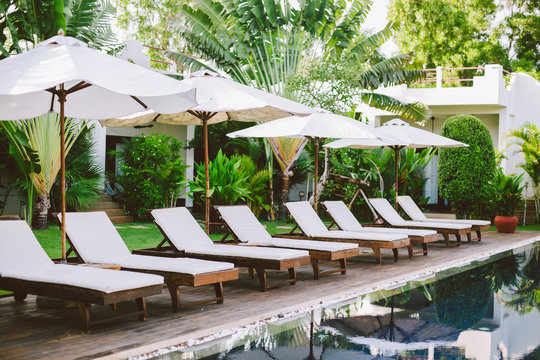 Daybeds by luxury swimming pool
