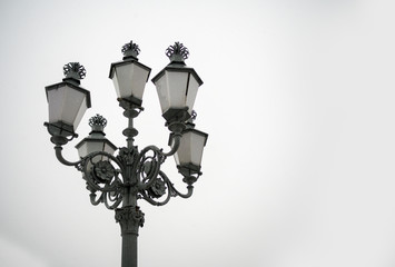 Fototapeta na wymiar Dark vintage filtered on street lamps with grey sky background