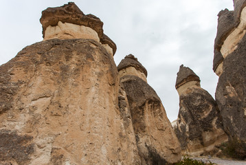 Fototapeta premium Colorful hot air balloons flying over the valley at Cappadocia, Anatolia, Turkey. Volcanic mountains in Goreme national park.