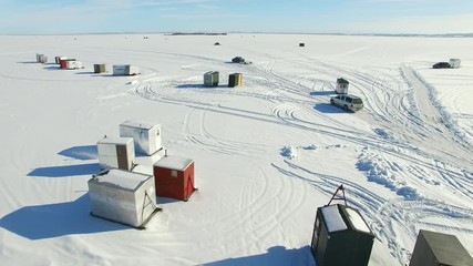 Wisconsin ice fishing shanty village on Lake Winnebago for sturgeon season. 
 - Powered by Adobe