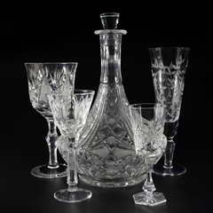 Utensils from crystal on a black background. 2
