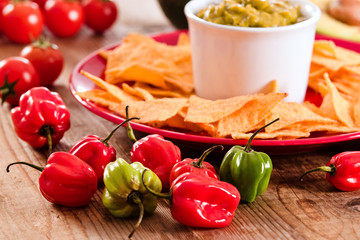 Guacamole and nacho chips.