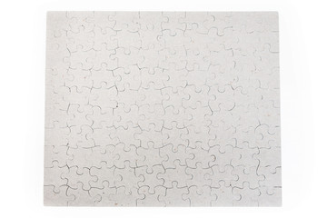 Blank whole puzzle put together isolated on white background