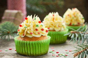 Christmas cupcakes with buttercream frosting and sugar confetti