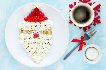 Christmas Santa Claus pancake with whipped cream and berry