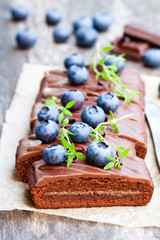 Chocolate  cake with chocolate cream and fresh blueberries