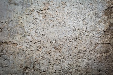 Old destroyed concrete wall with uneven structure