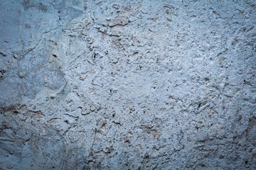 Old destroyed concrete wall with uneven structure