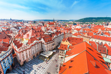 Fototapeta na wymiar Old Town Square in Prague from Clock Tower. Many colored houses at the bottom of the square. Aerial view