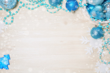 Blue Christmas decorations on wooden background with copy space