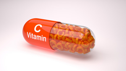 Orange pill or capsule filled with vitamin C.