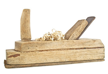 Old handed planer and wood shavings on a white background