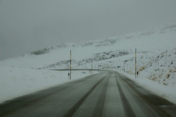 Misty mountain range road at winter