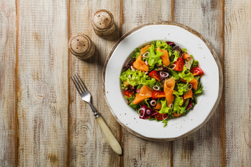Fresh salad with smoked salmon.