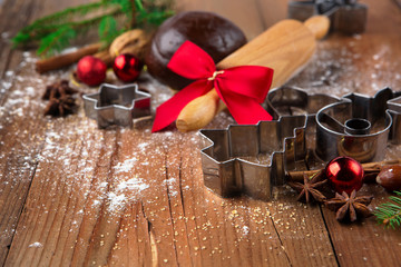Christmas baking background with gingerbread dough, cookie cutters and spices. Winter holiday concept. Selective focus