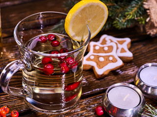 Top view of Christmas glass mug and Christmas Gingerbread Cookie on form stars on plate Mug...