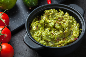Bowl of guacamole with fresh ingredients