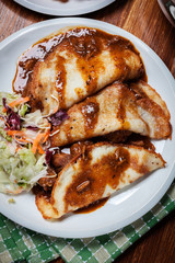 Potato pancakes with meat stew served