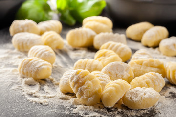 Uncooked homemade gnocchi - 128846265
