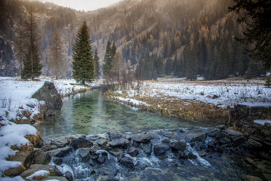 A small mountain river in the Italian Dolomites. Beautiful mount