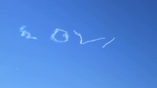 Skywriter writes LOVE in the cloud sky