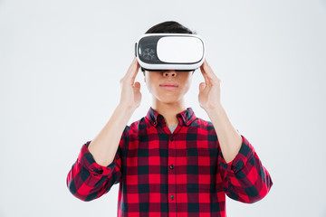 Young asian man wearing virtual reality device