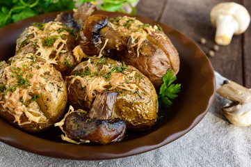 Baked potatoes with mushrooms, cheese and herbs on dark wooden background. Close up.