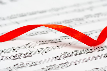music sheet, red ribbon