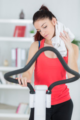 portrait of young girl training on a stepping machine