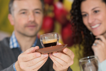 Man and lady examining espresso