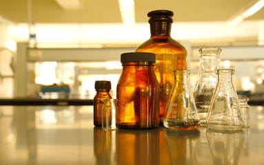 glass flask and retro brown bottle reagent in lab science