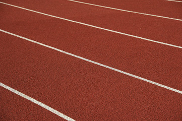 Fototapeta premium Athletics stadium running track white lines marks.