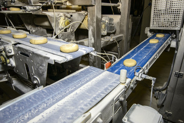 Bread dough running on conveyor belt