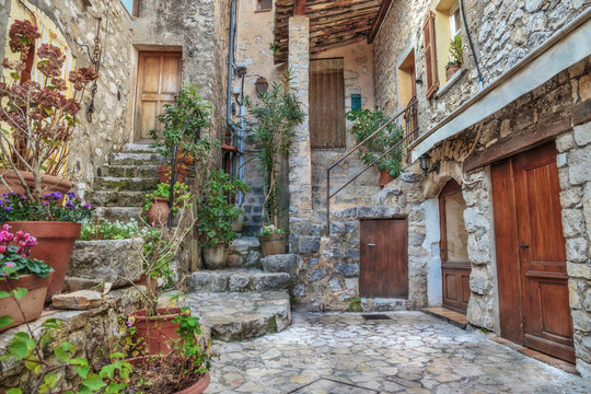 Patio With Flowers In The Old Village France