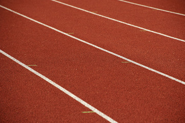 Fototapeta premium Athletics stadium running track white lines marks.