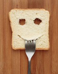 Happy toast with a fork in her mouth