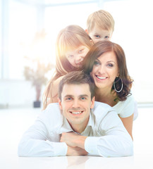 Obraz premium The pyramide of the smiling happy family